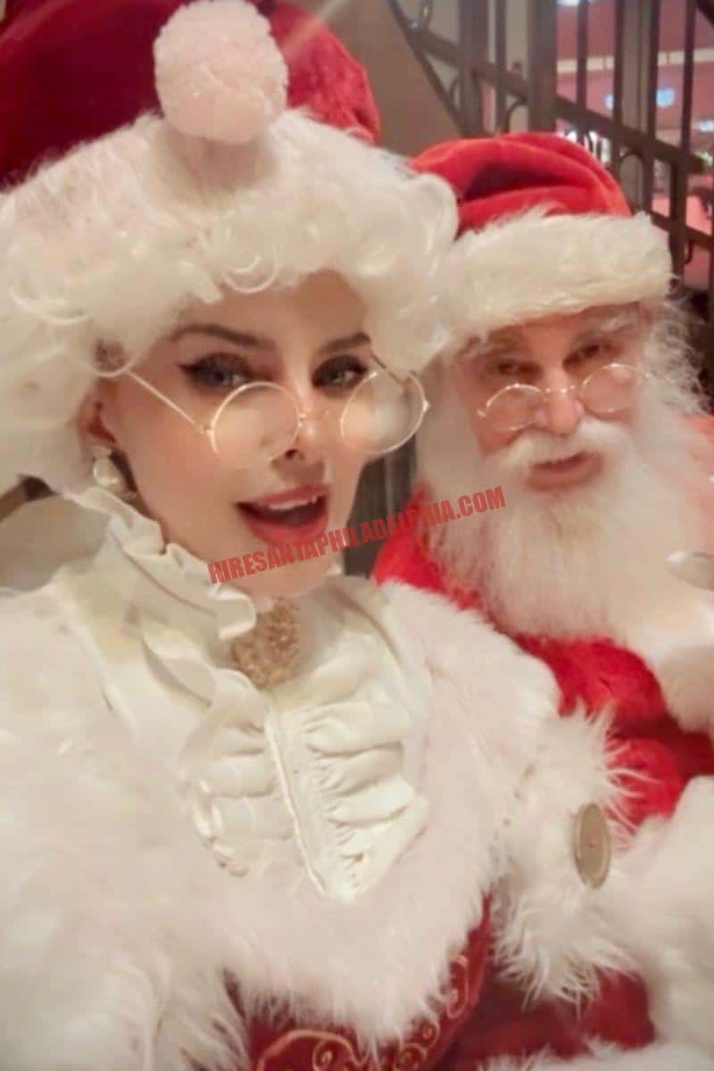 Hire a Santa near you in Philadelphia: Santa and Mrs. Claus close-up indoors in red and white.